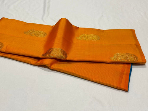 Mango Orange with Blue Handwoven Pure Jari Borderless Kanchipuram Silk Saree with Muthukattam and Buttas