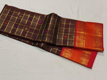 Vaibhogam- Gorgeous Coffee Brown with Red Handwoven Pure Zari Kanijivaram Silk with rich jari checks and meena buttas woven beautiful body with rich borders pallu very intricately woven and contrast woven blouse