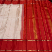 Sarasangi- Stunning Offwhite with Burnt Orange Checked Handwoven Pure Jari Korvai Kanjivaram Silk with beautiful doublepet borders rich pallu and contrast woven blouse
