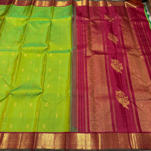 Vaibhogam- Gorgeous Parrot Green with Deep Red Handwoven Pure Jari Korvai Kanjivaram Silk with beautiful thilagam and mayil buttas woven body with beautiful borders rich parrot motifs woven beautiful pallu and contrast woven blouse