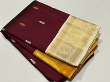 Vaibhogam- Gorgeous Deep Maroon with Mustard and Offwhite Handwoven Pure Jari Korvai Kanjivaram Silk with buttas woven body rich borders dancing women and musical instruments woven pallu and contrast woven blouse