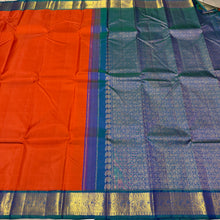 Vaibhogam- Gorgeous Burnt Orange with Peacock Blue Handwoven Pure 2g Jari Korvai Kanjivaram Silk with plain body rich borders gorgeous pallu and contrast woven blouse