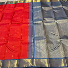 Vaibhogam- Strikingly Beautiful Fanta Orange with Grey Buttas Handwoven Pure Jari Korvai Kanjivaram Silk with beautiful borders rich pallu and contrast woven blue woven blouse