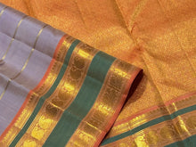 Sahana- Gorgeous Light Lavendar with Peach Handwoven Pure Jari Kanjivaram Silk with Jari Veldhari woven body with Rettapet borders gorgeous pallu and contrast peach blouse with jari stripes