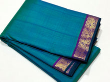 Nayaki- Beautiful Peacock Blue Green with Purple Small Border Handwoven Pure Jari Kanjivaram Silk with rich borders pallu and contrast woven blouse