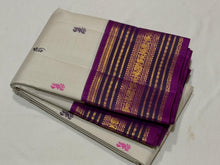 Vaibhogam- Gorgeous Offwhite with Purple Handwoven Pure Zari Korvai Kanjivaram Silk with Pattu Buttas woven body with rich varisaipet borders with beautiful pallu and contrast woven purple blouse