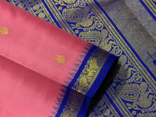 Sarasangi- Gorgeous Peachish Pink with Blue Handwoven Pure Jari Korvai Kanjivaram Silk with Oru kunjam Pillayar moggu with body buttas woven rich meena buttas woven pallu and contrast woven blouse