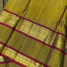 Sahana- Black with Bronze Gold Handwoven Pure Kanjivaram Silk with beautiful buttas woven body with doublepet borders rich zari and thread woven gorgeous pallu and contrast woven blouse