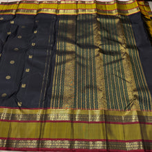 Sahana- Black with Bronze Gold Handwoven Pure Kanjivaram Silk with beautiful buttas woven body with doublepet borders rich zari and thread woven gorgeous pallu and contrast woven blouse