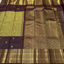 Vaibhogam- Gorgeous Elaichi Green with Coffee Brown Vairaoosi with Buttas Handwoven Pure 2g Jari Kanjivaram Silk with beautiful broad coffee brown borders rich pallu and contrast woven blouse