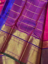 Dual tone Rani Pink with Purple in a rich Handwoven Pure Kanjivaram Silk Saree with Doubleparrots woven in jari checked body beautiful borders pallu and contrast woven blouse