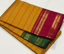 Sarasangi- Gorgeous Mustard with Ganga Jamuna Borders Handwoven Pure Jari Korvai Kanjivaram Silk with Neli Veldhari woven beautiful body with beautiful ganga jamuna doublepet borders classic seer pallu and contrast woven arakku red blouse