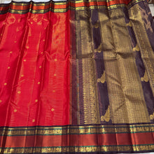 Stunning Red with Coffee Brown Vairaoosi with Buttas and Doublepet Meenakari Matte Finish Borders in Jari and Silk threads in a Pure Jari Handwoven Kanjivaram Silk with super gorgeous Kalakshetra kilis woven pallu and a very beautiful contrast blouse.