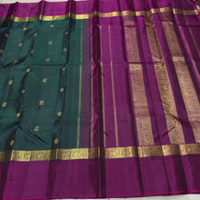 Sahana- Stunning Bottle Green with Dark Magenta Mayil Chakram Buttas Handwoven Pure 2g Jari Kanjivaram Silk with Spaced borders rich pallu and contrast woven blouse