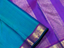Nayaki- Beautiful Peacock Blue Green with Purple Small Border Handwoven Pure Jari Kanjivaram Silk with rich borders pallu and contrast woven blouse