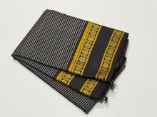 Saraswati- Stunning Deep beetlenut purplish brown handwoven pure zariless kanchipuram silk with striped body with rettapet green and yellow colors kamalam and paisley motifs woven beautiful borders classic seer pallu and contrast woven blouse