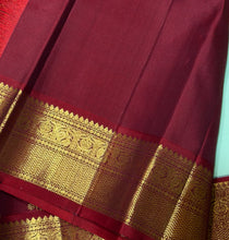 Vaibhogam- Gorgeous Pista Green with Violetish blue and Burgundy Maroon Handwoven Pure 2g Jari Korvai Kanjivaram Silk with Pattu Buttas woven body rich borders ganga Jamuna beautiful pallu and contrast woven blouse