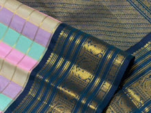 Vaibhogam- Beautiful Palum Pazhamum Jari Checks in pastel palette of colors in Handwoven Pure Zari Korvai Kanjivaram Silk with rich jari checks body with Deep sapphire blue borders intricate and beautifully woven with rich pallu and contrast blouse
