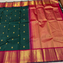 Vaibhogam- Stunning Bottle Green with Tomato Orange Pink Handwoven Pure 2gram Jari Korvai with Mayil Chakram Buttas Kanjivaram Silk with rich borders beautiful pallu and contrast woven blouse