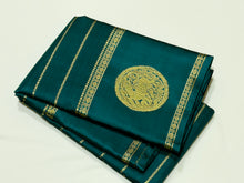 Sahana- Mesmerizing Deep Teal with Gold Handwoven Pure Jari Kanjivaram Silk with beautiful Neliveldhari Woven body with yazhis and gandaberundas woven beautiful doublepet borders with rich and self colored blouse