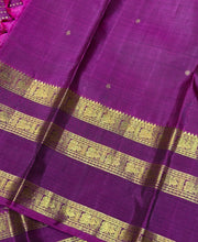 Sarasangi- Stunning Elaichi Green with Deep Magenta Buttas Handwoven Pure 2g Jari Korvai Kanjivaram Silk with beautiful doublepet borders rich woven pallu and contrast woven blouse