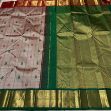 Vaibhogam-Gorgeous Beige Abirami with Ganga Jamuna borders Striped body with silk thread buttas with rich bottle green rich and beautifully wovwn pallu and contrast woven blouse