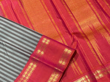 Gorgeous Handwoven Pure Jari Korvai Kanjivaram Silk Saree with greyish blue and dark grey striped body with gorgeous dual tone kanakambaram orange pink rettapet rudrakshas woven borders rich temple rekku pallu and contrast woven blouse