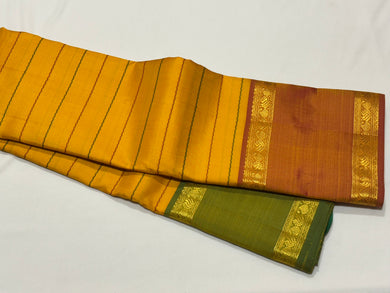 Mustard with Ganga Jamuna Borders with Dual tone Orange mustard Pallu and blouse in a beautiful Neli Veldhari Handwoven Pure Jari Kanjivaram Silk Saree beauty
