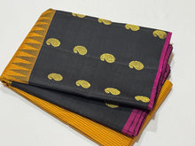 Gorgeous Mustard with Black Podikattam Checked Body with Beautiful Paisleys and small temples woven double side borders with dark Magenta Selvedges with Rich Seepu Seer Pallu and Contrast woven blouse