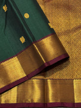 Sahana- Gorgeous Bottle Green with Deep Maroon Mayil Chakram Buttas Handwoven Pure Jari Kanjivaram Silk with beautiful bawanchi borders rich pallu and contrast woven blouse