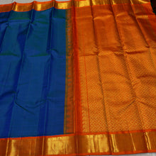 Sarasangi- Beautiful Peacock Blue with Orange Handwoven Pure Jari Korvai Kanjivaram Silk with beautiful borders rich pallu and contrast woven blouse
