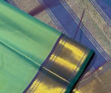 Nayaki- Gorgeous Pastel Green with Double tone Blue Handwoven Pure Kanjivaram Silk with beautiful bawanchi borders with rich pallu and contrast woven blouse