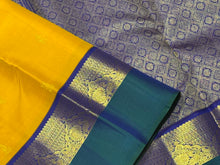 Vaibhogam-Gorgeous Golden Mustard with Peacock Blue and Violetish Blue Buttas Handwoven Pure Jari Korvai Kanjivaram Silk with Spaced borders rich pallu and contrast woven blouse. A very beautiful piece for this wedding season!
