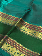 Black with Emerald Green Handwoven Pure Kanjivaram Silk Saree with thilagam buttas woven body doublepet borders elephants woven pallu and contrast blouse
