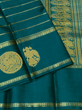Sahana- Mesmerizing Deep Teal with Gold Handwoven Pure Jari Kanjivaram Silk with beautiful Neliveldhari Woven body with yazhis and gandaberundas woven beautiful doublepet borders with rich and self colored blouse