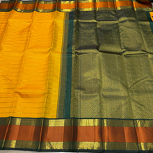 Vaibhogam- Stunning Yellow with Bottle Green Handwoven Pure2g Jari Korvai Kanjivaram Silk with Jari Veldhari woven body with rich silk threads and Jari woven beautiful borders gorgeous pallu and contrast woven blouse