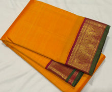 Sarasangi- Vintage Style Mambazham Yellow with Arakku Handwoven Pure 2g Jari Korvi Kanjivaram Silk with Green Selvedges with beautiful gandaberundas woven borders rich pallu and contrast woven blouse