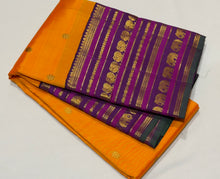Vaibhogam- Stunning Mambazha Orange (Mango Orange) with Deep Purple Varisaipet Borders with Buttas Handwoven Pure Jari Korvai Kanjivaram Silk with stunning borders rich lakshadeepam style woven pallu and contrast woven beautiful blouse