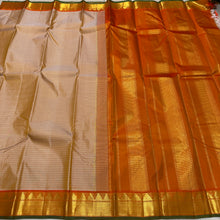 Sahana- Gorgeous Beige with Rustic Orange Handwoven Pure Jari Kanjivaram Silk with Muthukattam checks woven body with beautiful borders with green selvedges rich seer pallu and contrast woven blouse