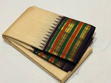 Vaibhogam -Gorgeous Handwoven Pure Jari Vairaoosi Korvai Kanjivaram Silk in tussar white with kanchana black combination with varisaipet beautiful borders with temples woven with rich pallu and contrast Vairaoosi woven beautiful blouse