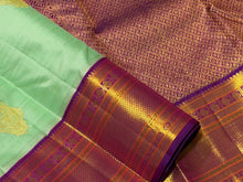 Vaibhogam- Beautiful Pista Green with Purple Handwoven Pure Jari Korvai Kanjivaram Silk with Buttas woven body rich borders pallu and contrast woven blouse