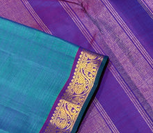 Nayaki- Gorgeous Peacock Bluish Green with Purple with Small borders Handwoven Pure Jari Kanjivaram Silk with rich seer pallu and contrast woven purple blouse