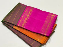 Sahana- Gorgeous Dual tone Manthulir with Golden Mustard and Rani Pink Ganga Jamuna Rettapet  Borders  Handwoven Pure Jari Kanjivaram Silks with Neliveldhari striped body with rich buttas woven beautiful pallu and contrast pink blouse.