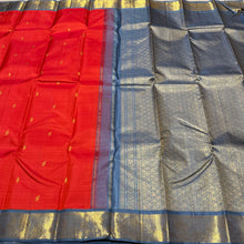 Vaibhogam- Strikingly Beautiful Fanta Orange with Grey Buttas Handwoven Pure Jari Korvai Kanjivaram Silk with beautiful borders rich pallu and contrast woven blue woven blouse