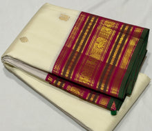 Vaibhogam-Gorgeous Offwhite with Pink Handwoven Pure Jari Korvai with Buttas Kanjivaram Silk with beautiful varisaipet borders and green selvedges rich pallu and contrast woven pink blouse