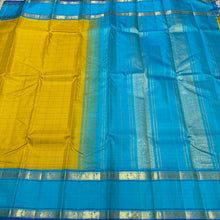 Sarasangi-Gorgeous Golden Lemon Sampanga with Sky Blue handwoven pure Jari Korvai Kanjivaram Silk with beautiful checked body with rich rettapet borders with deep blue jamudu , seer rich pallu and contrast woven blue blouse