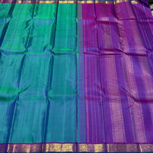 Nayaki- Gorgeous Peacock Bluish Green with Purple with Small borders Handwoven Pure Jari Kanjivaram Silk with rich seer pallu and contrast woven purple blouse