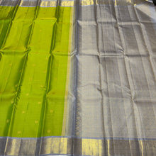 Vaibhogam- Gorgeous Parrot Green with Grey Handwoven Pure 2g Jari Korvai with Vairaoosi woven body with Buttas in a Kanjivaram Silk with rich borders gorgeous pallu and contrast woven grey vairaoosi blouse