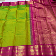 Vaibhogam- Stunning Parrot Green with Rani Pink Vairaoosi Checks Handwoven Pure Jari Korvai Kanjivaram Silk with beautiful rich borders gorgeous pallu and contrast Vairaoosi blouse