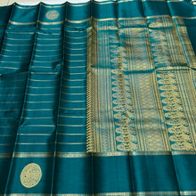 Sahana- Mesmerizing Deep Teal with Gold Handwoven Pure Jari Kanjivaram Silk with beautiful Neliveldhari Woven body with yazhis and gandaberundas woven beautiful doublepet borders with rich and self colored blouse